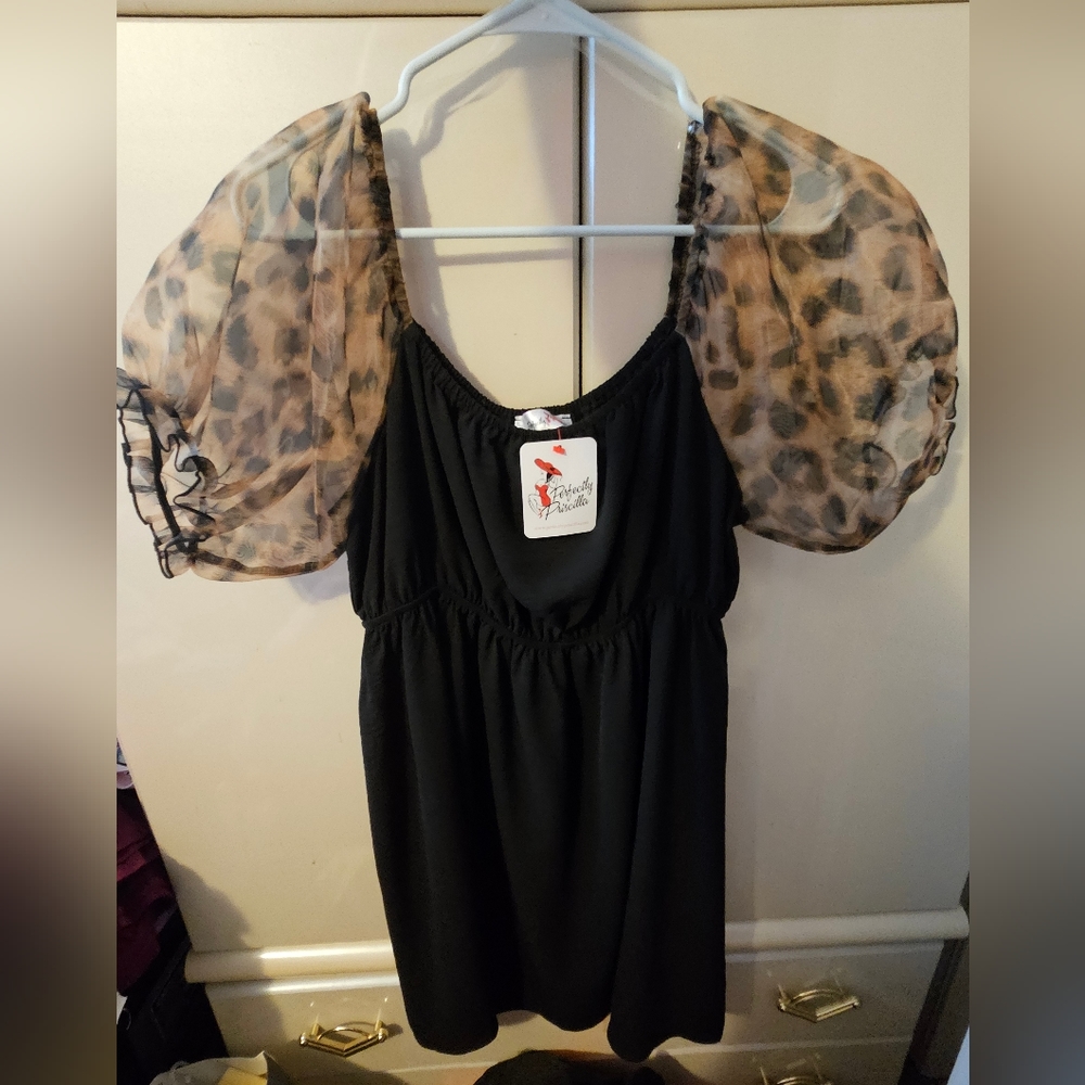 Black dress with sheer leopard puff sleeves